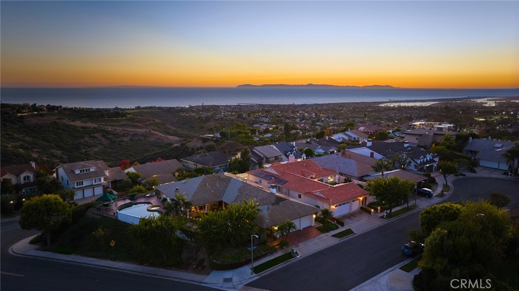 an aerial view of residential houses and outdoor space