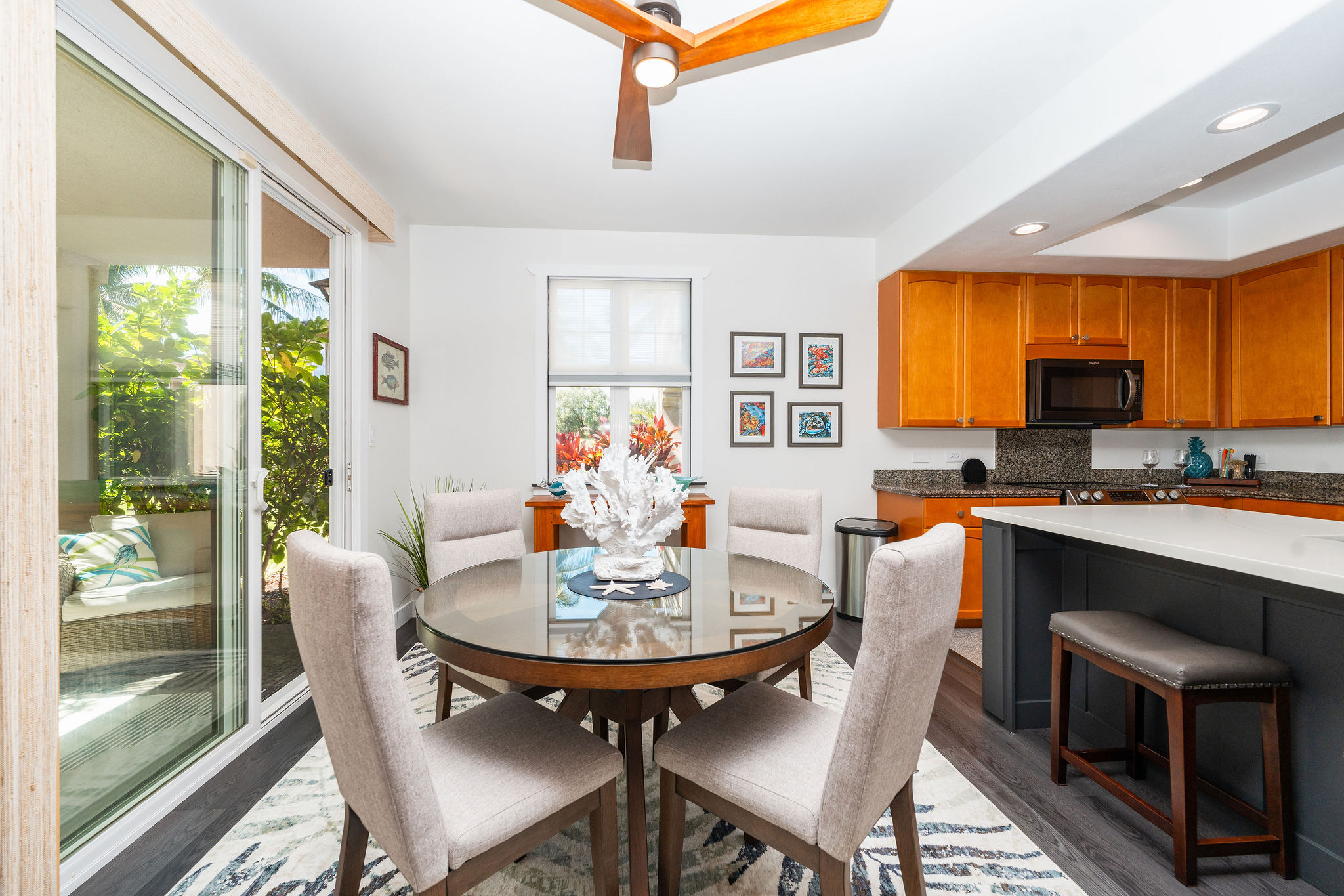 a kitchen with a dining table chairs and a refrigerator