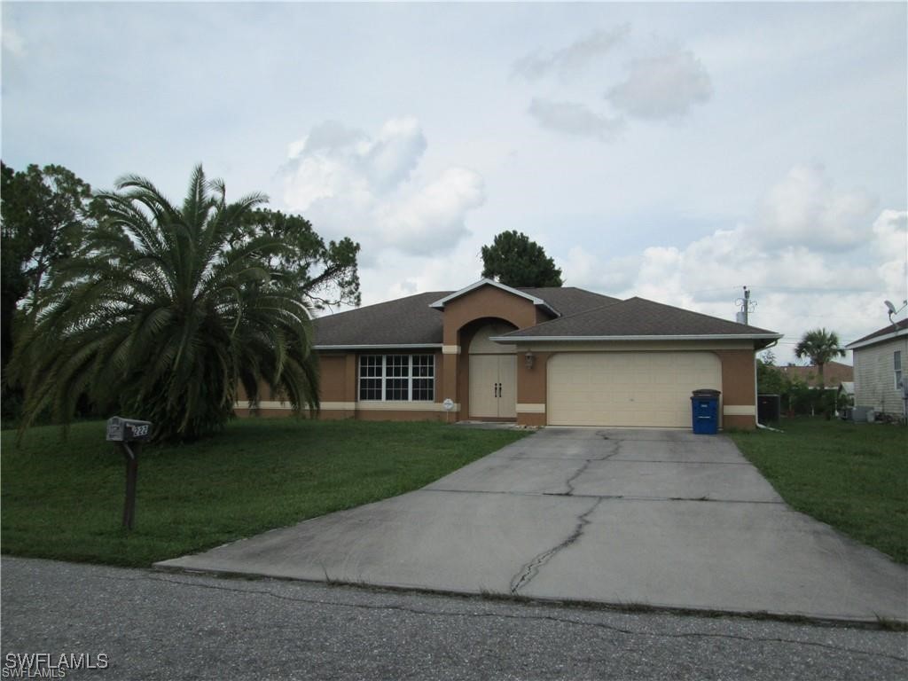 front view of a house with a yard