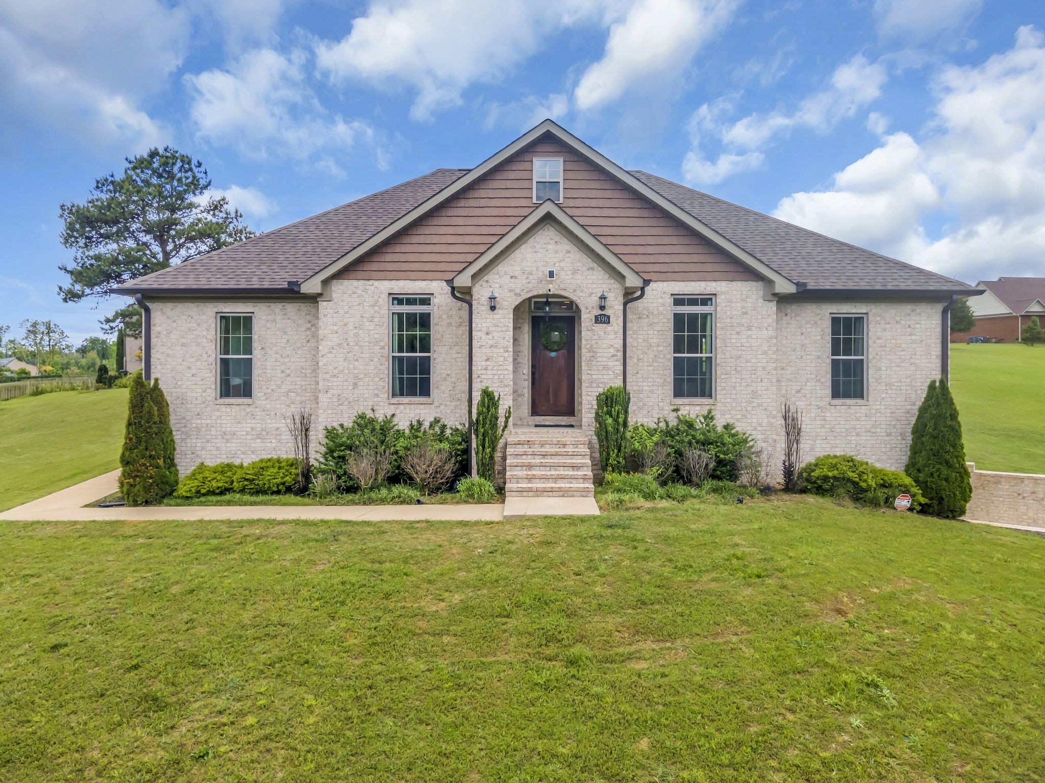 a front view of a house with a yard