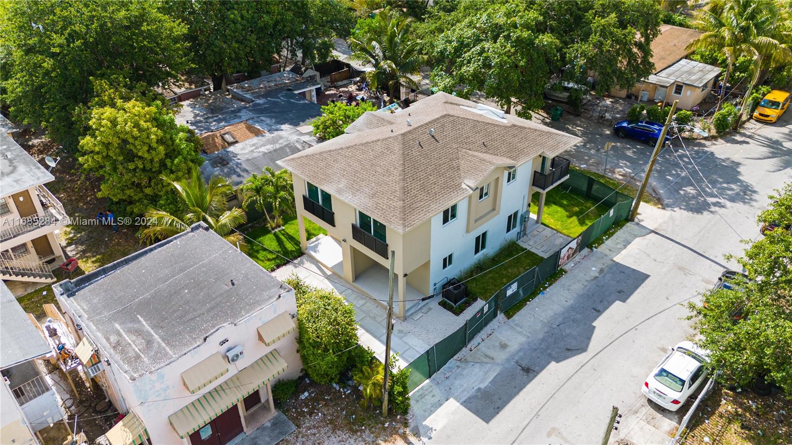 an aerial view of a house with a yard