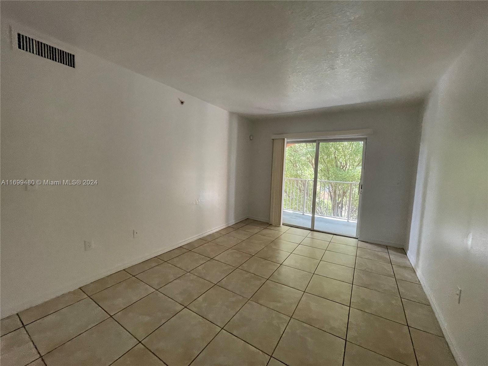 a view of an empty room and window