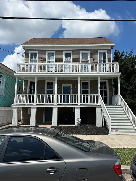 a front view of a house with a road