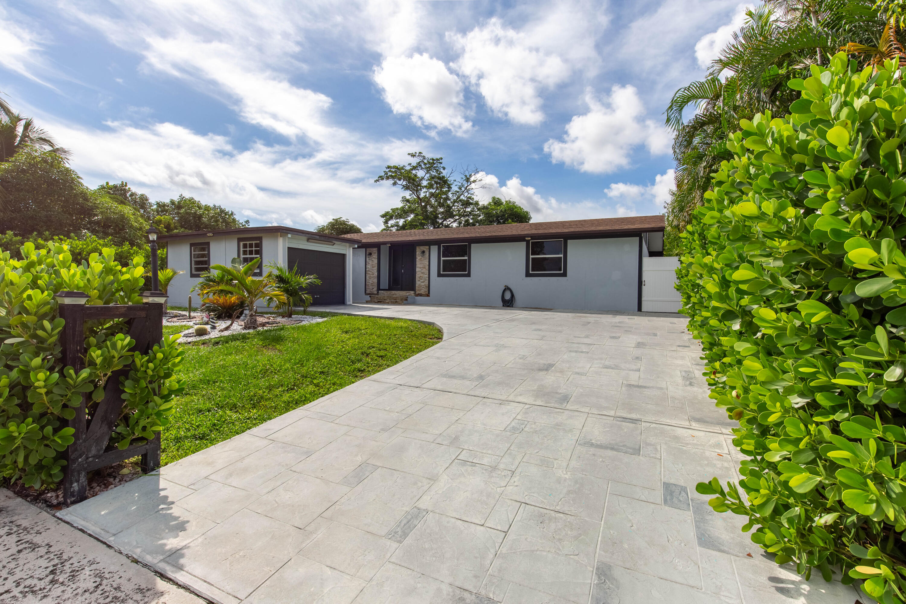 a front view of a house with garden