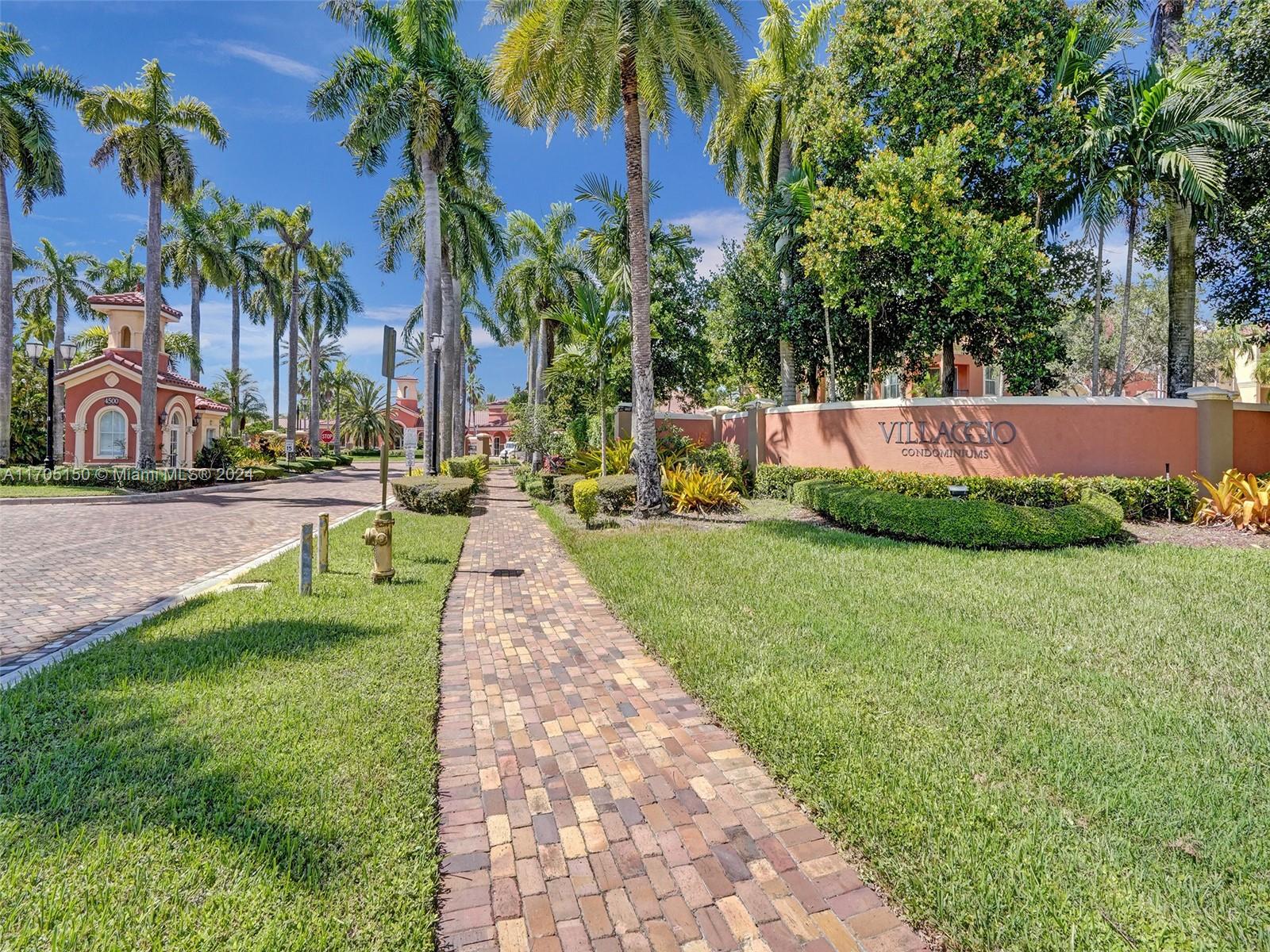 a view of yard with swimming pool and green space