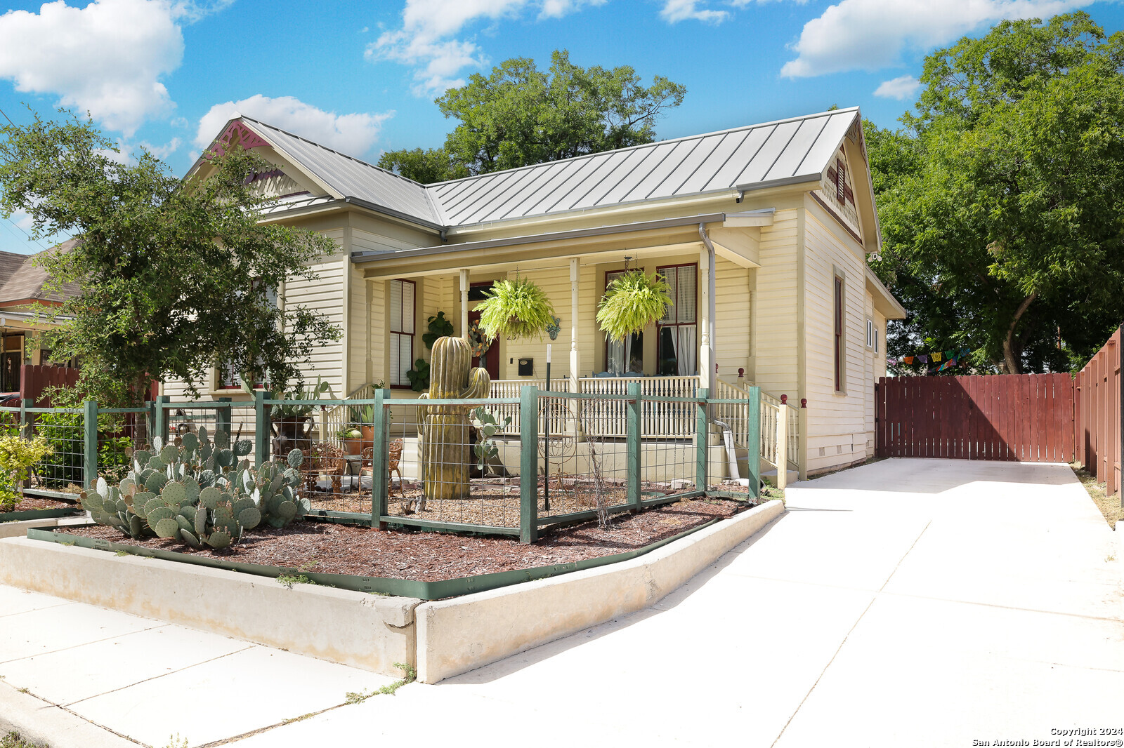 a view of a house with entrance gate