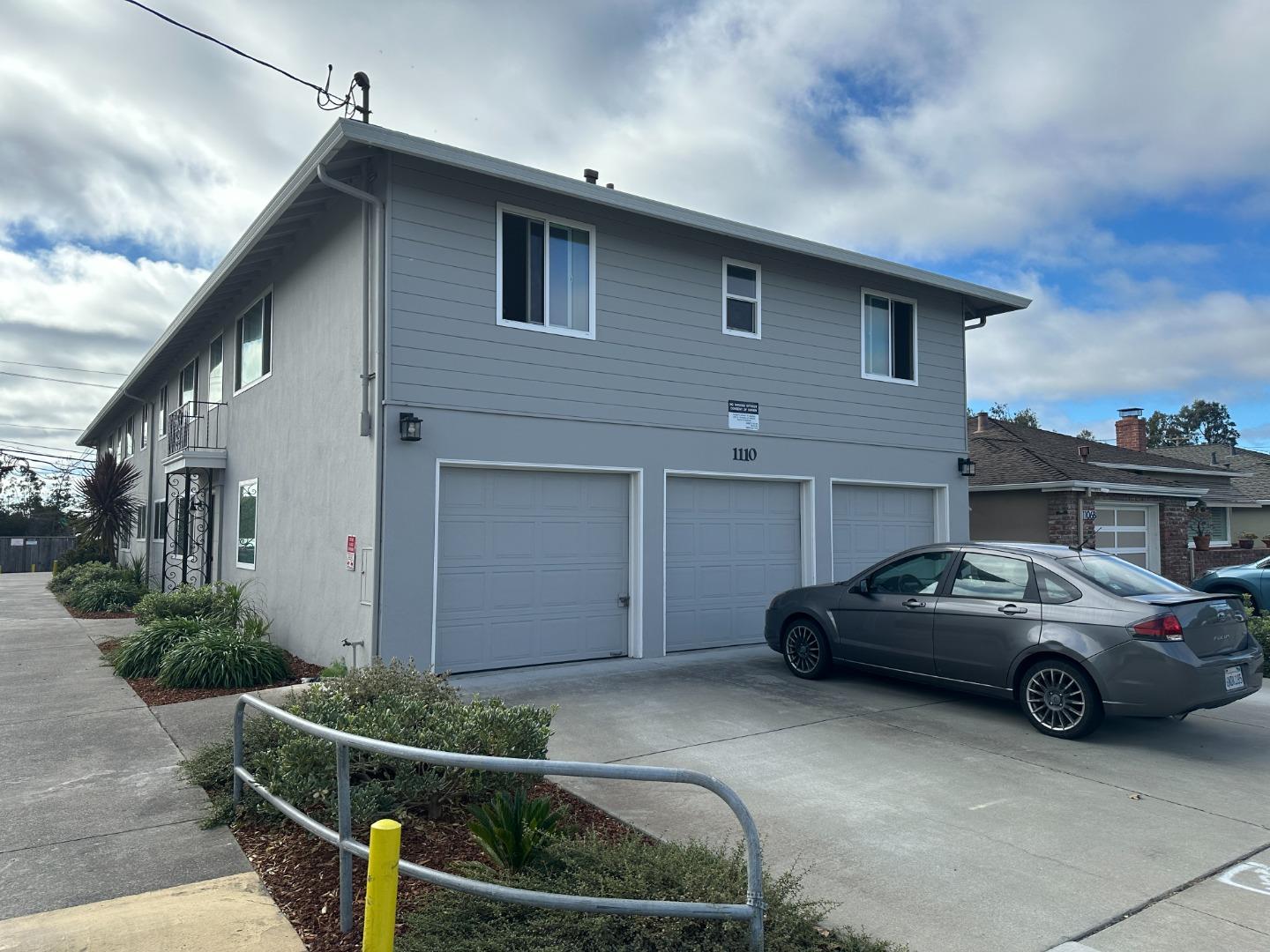 a front view of a house with parking