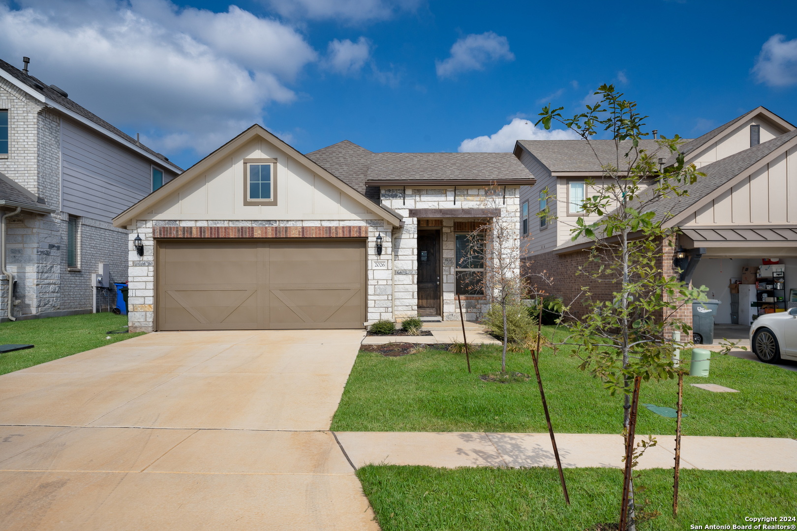 a front view of a house with a yard