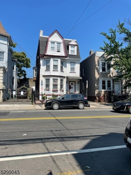 a front view of a building with street view