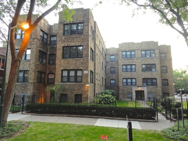 a front view of a building with garden