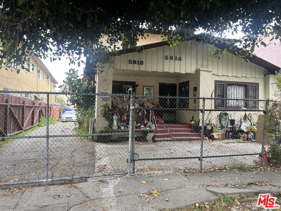 a view of a house with a tree park