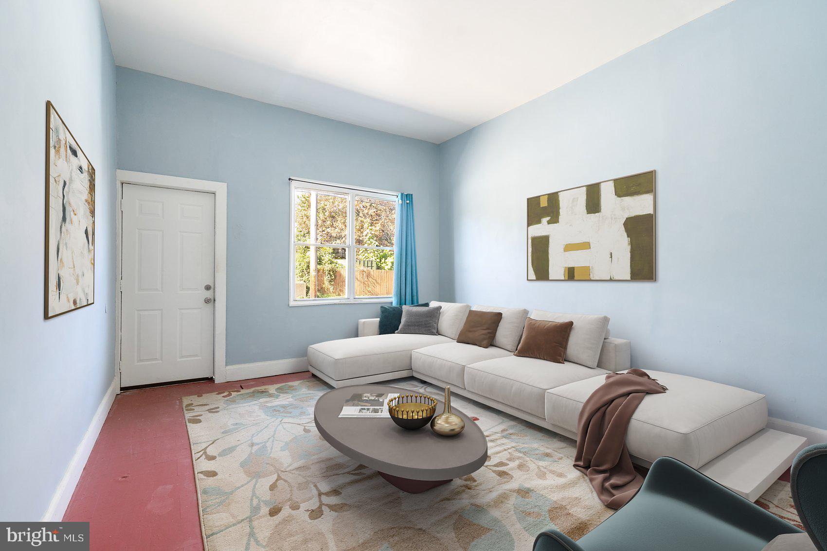 a living room with furniture and a window