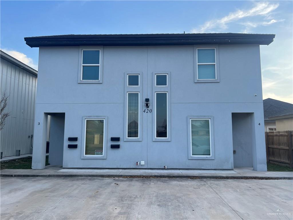 a front view of a house with garage