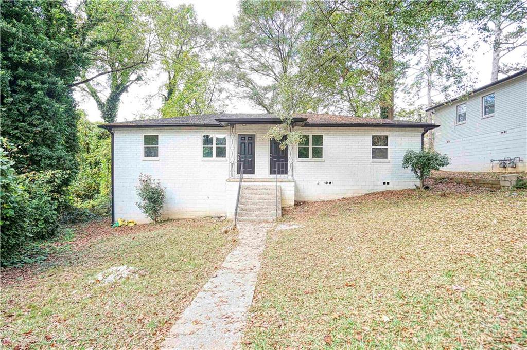 front view of house with a yard