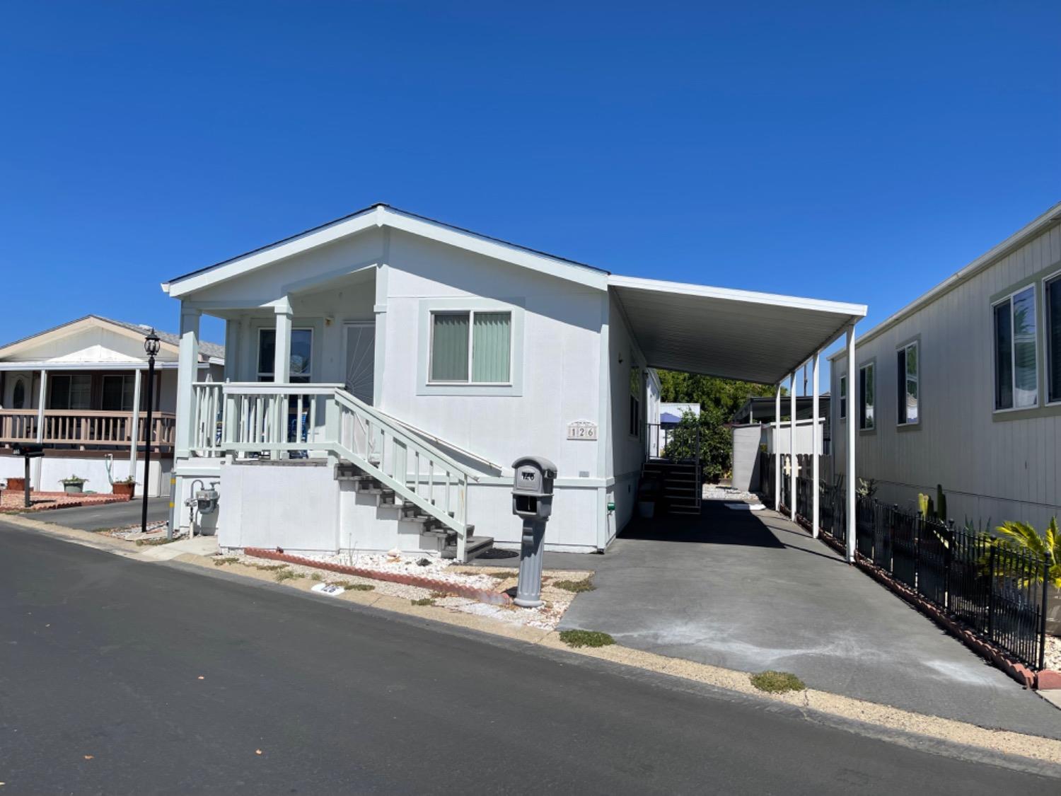 a front view of a house with garage