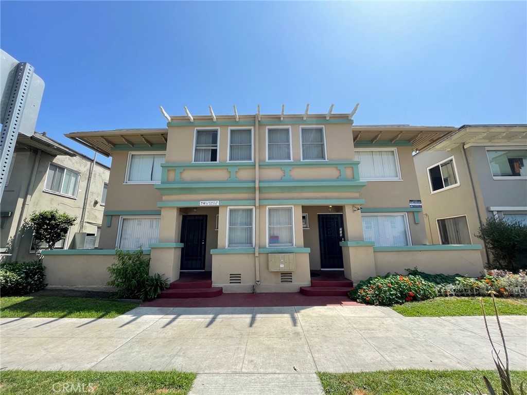 a front view of a house with yard