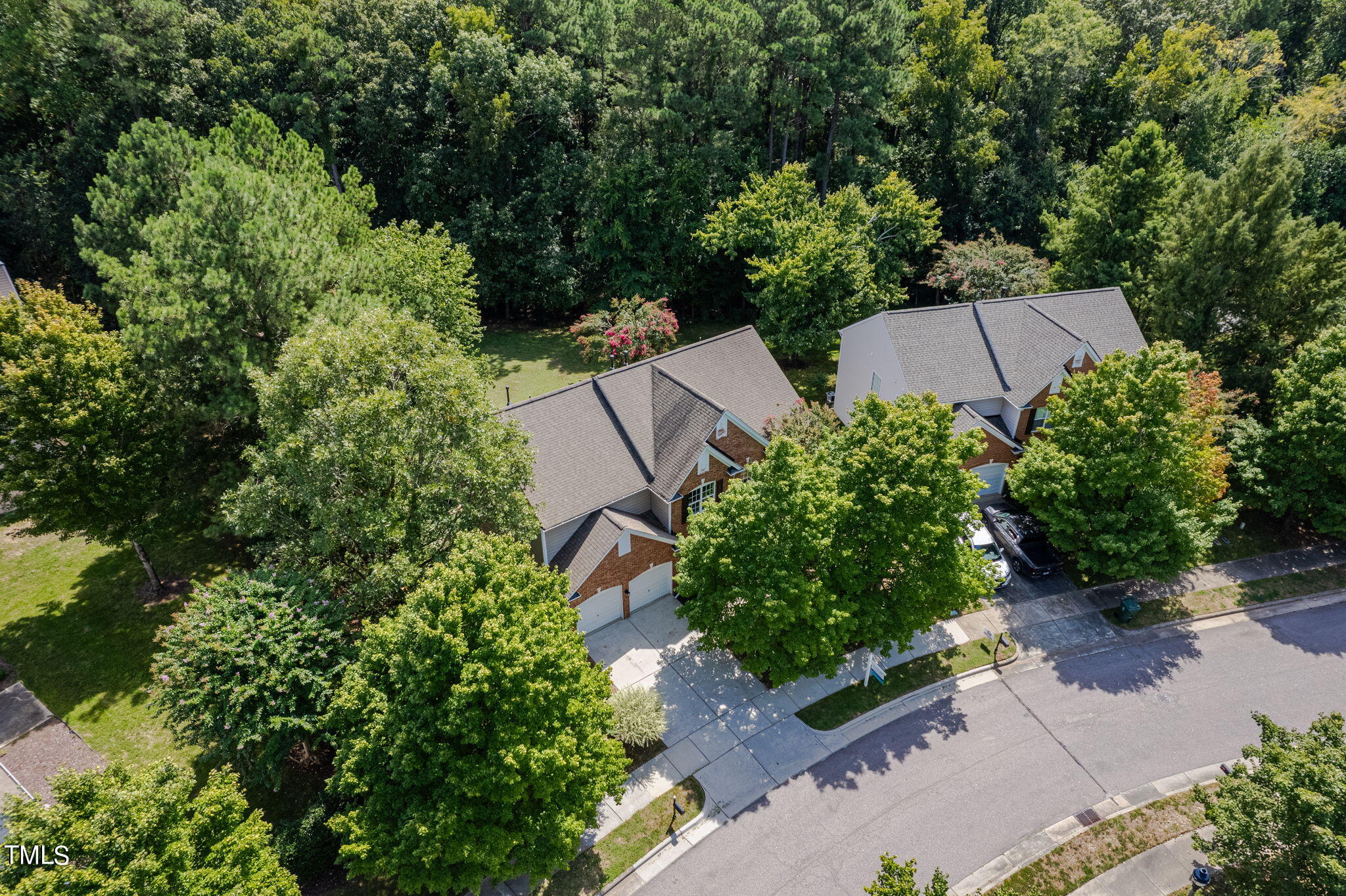 an aerial view of a house with a yard and garden