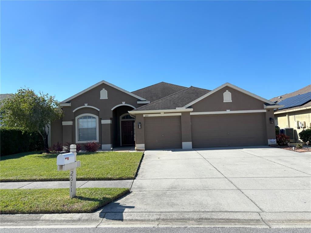 a front view of a house with yard