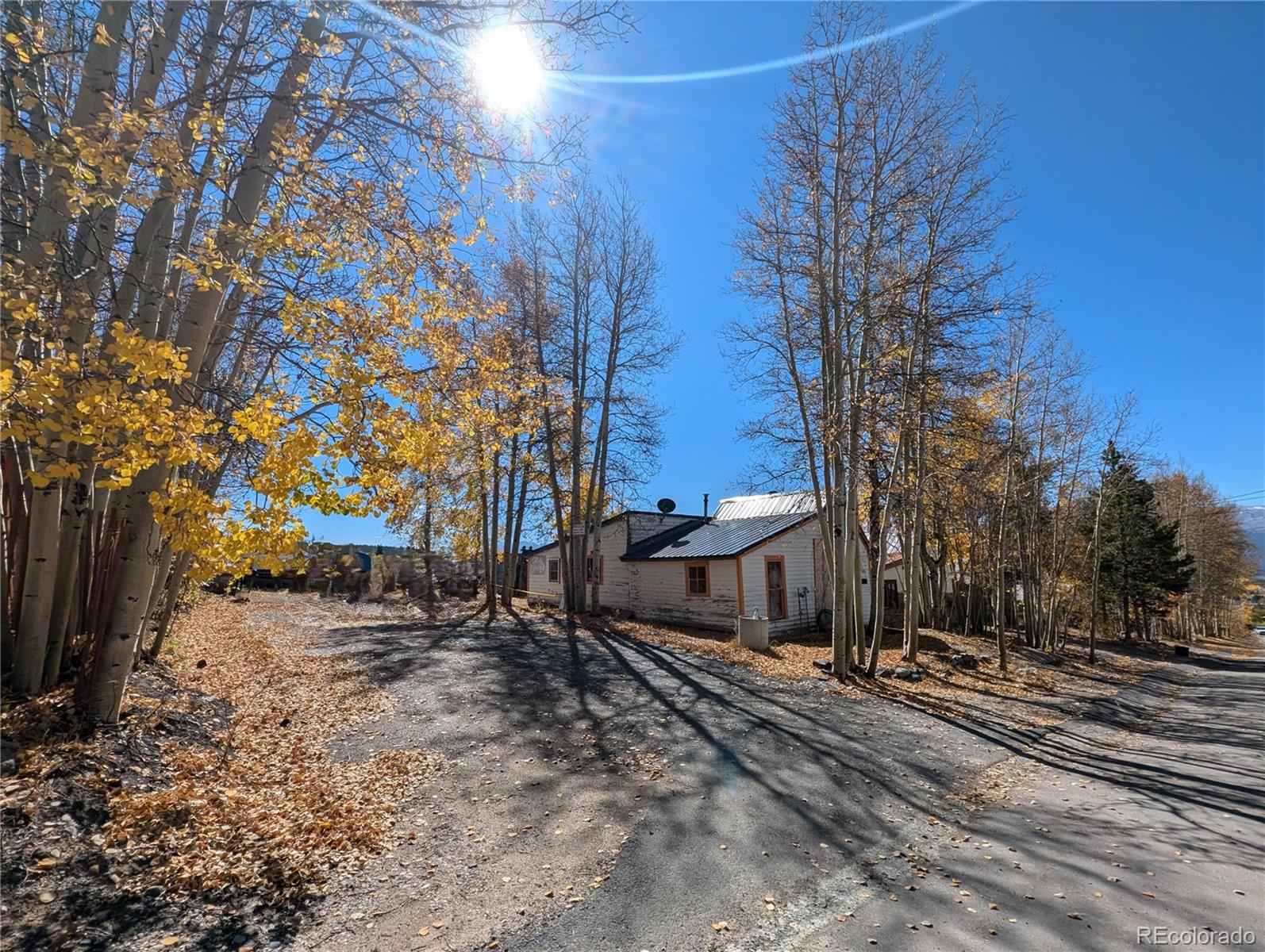 a view of a house with a yard covered in snow