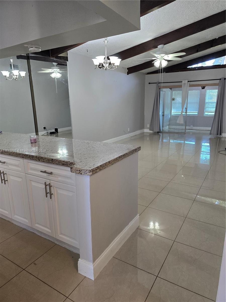 a bathroom with a sink a vanity and a mirror