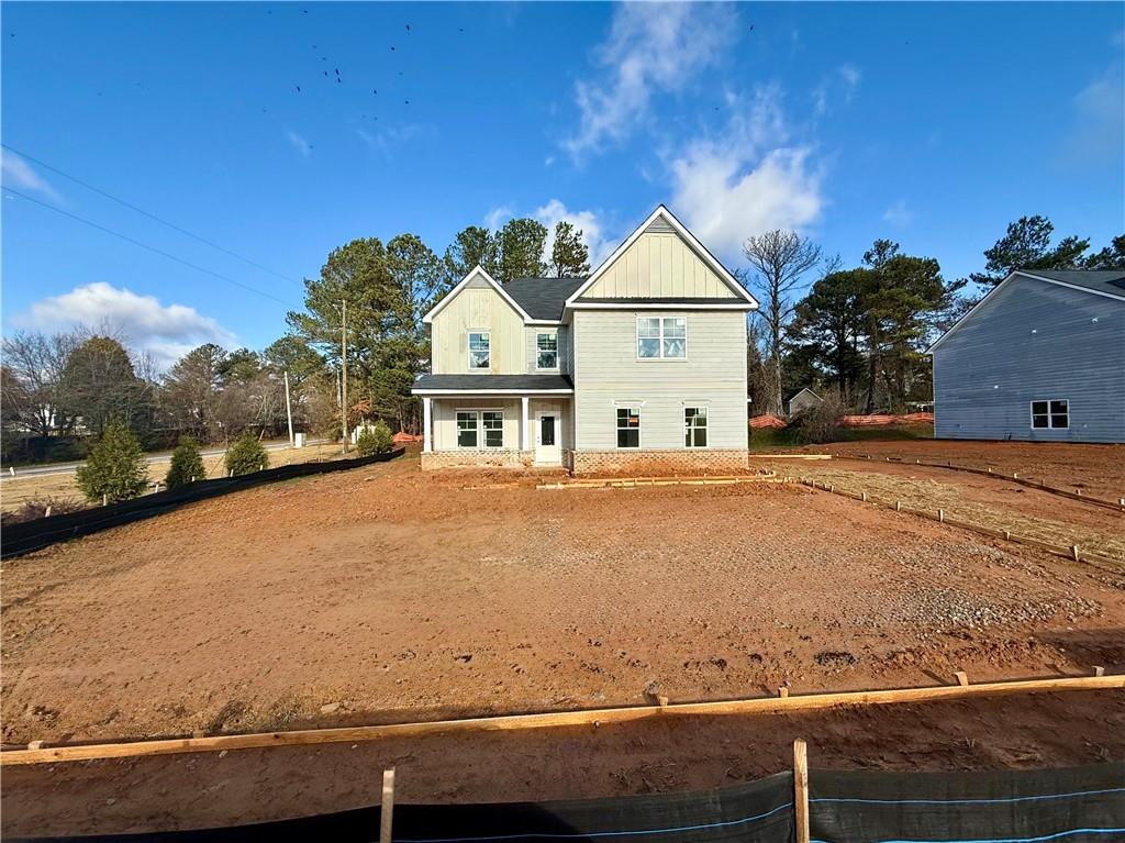 a view of house with yard