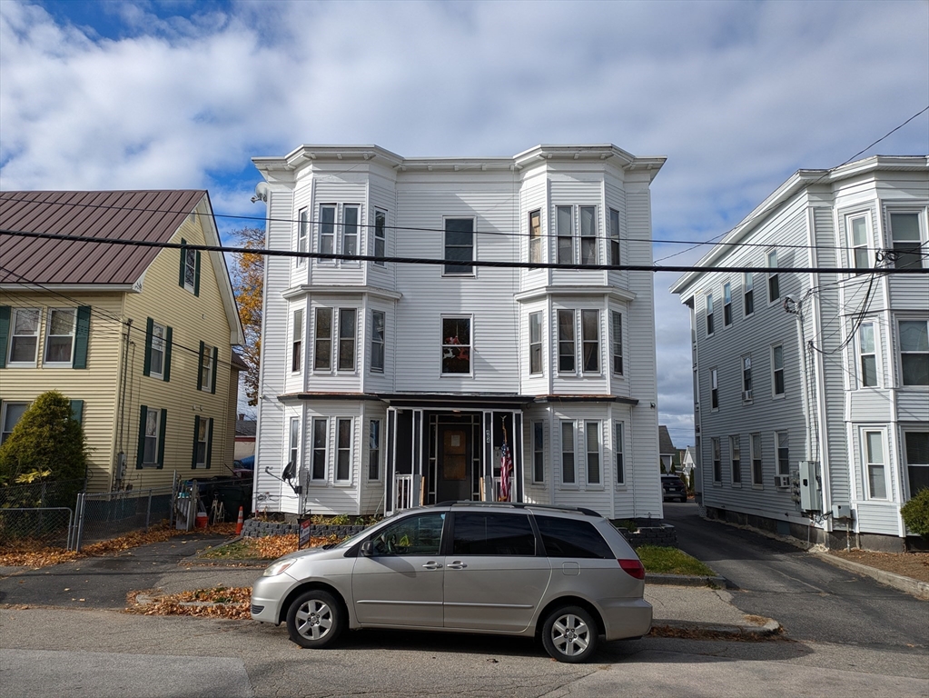 a car parked in front of a house