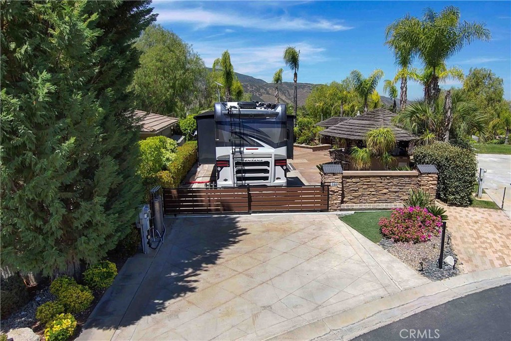 a view of a backyard with sitting area