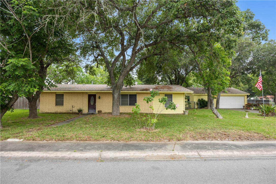 front view of a house with a yard