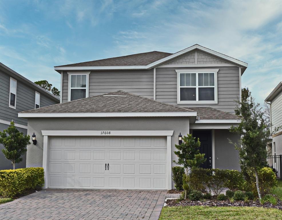 a front view of a house with a garage