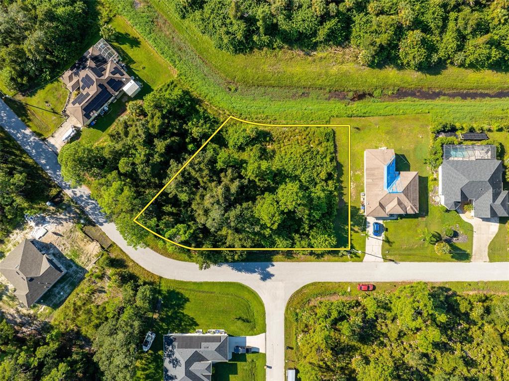 an aerial view of a house having swimming pool patio and lake view