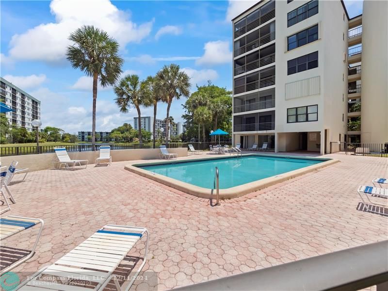 a view of a swimming pool with a house