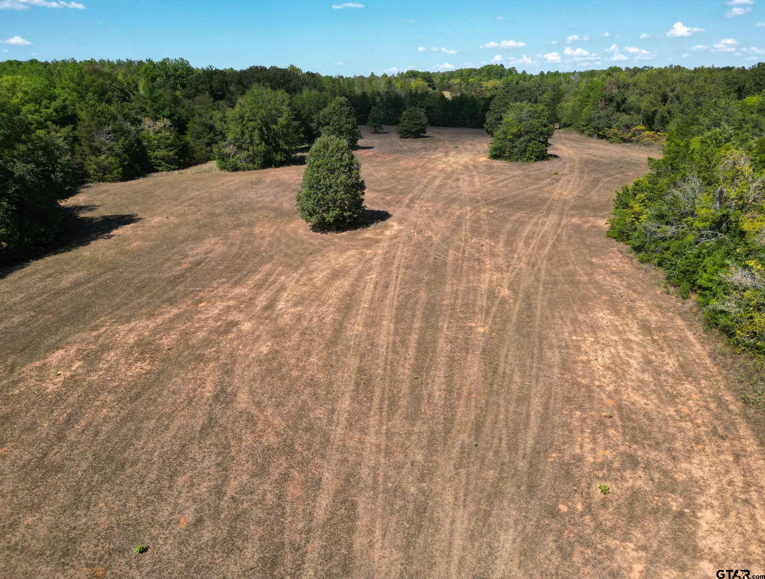 a view of a road with a yard