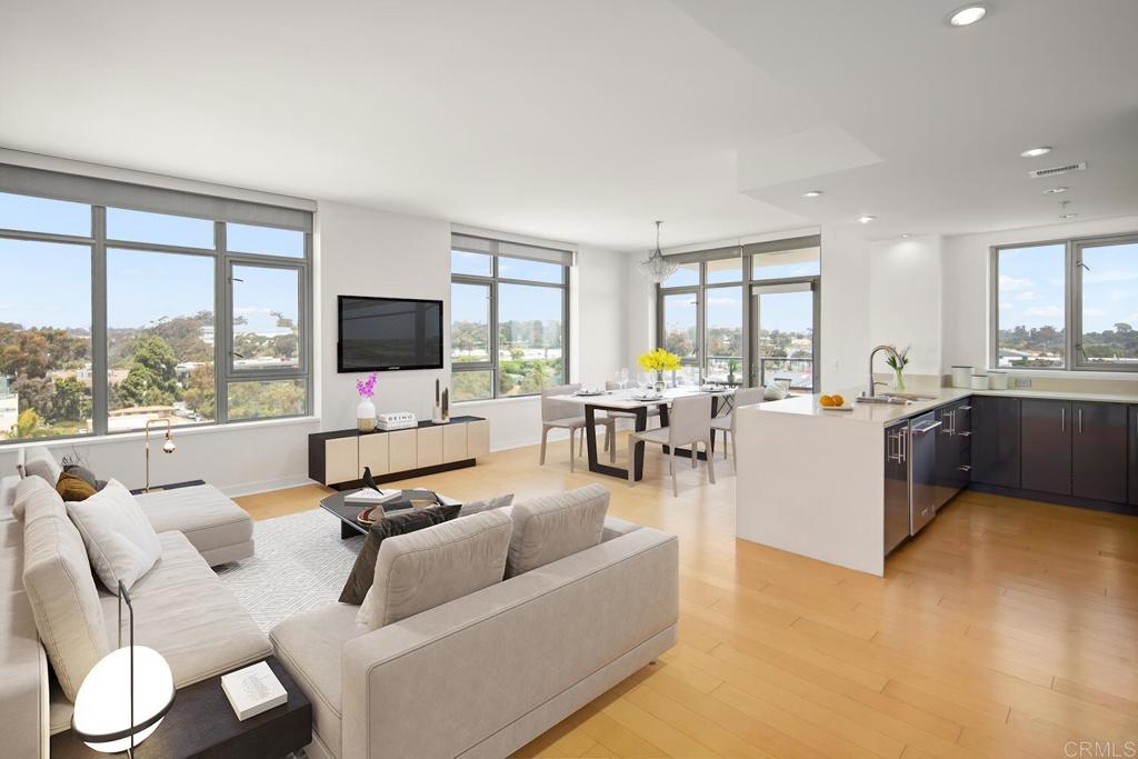 a living room with furniture flat screen tv and a large window