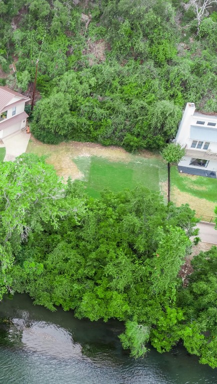 an aerial view of a house with pool yard outdoor seating and yard