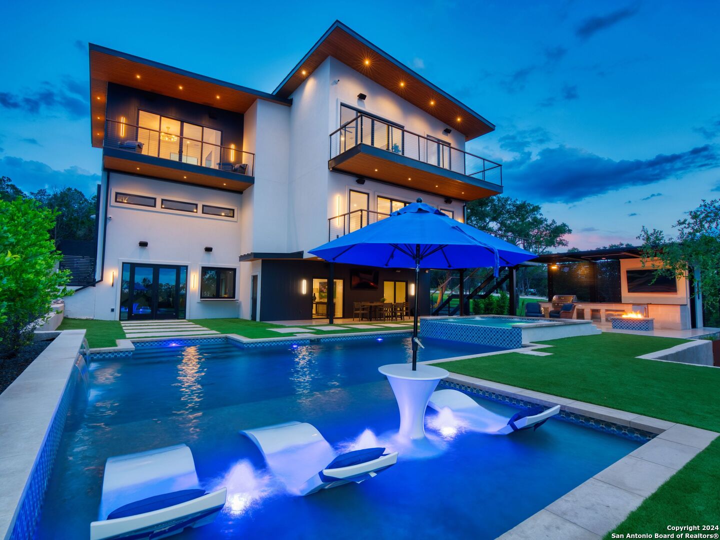 a front view of house with yard and outdoor seating