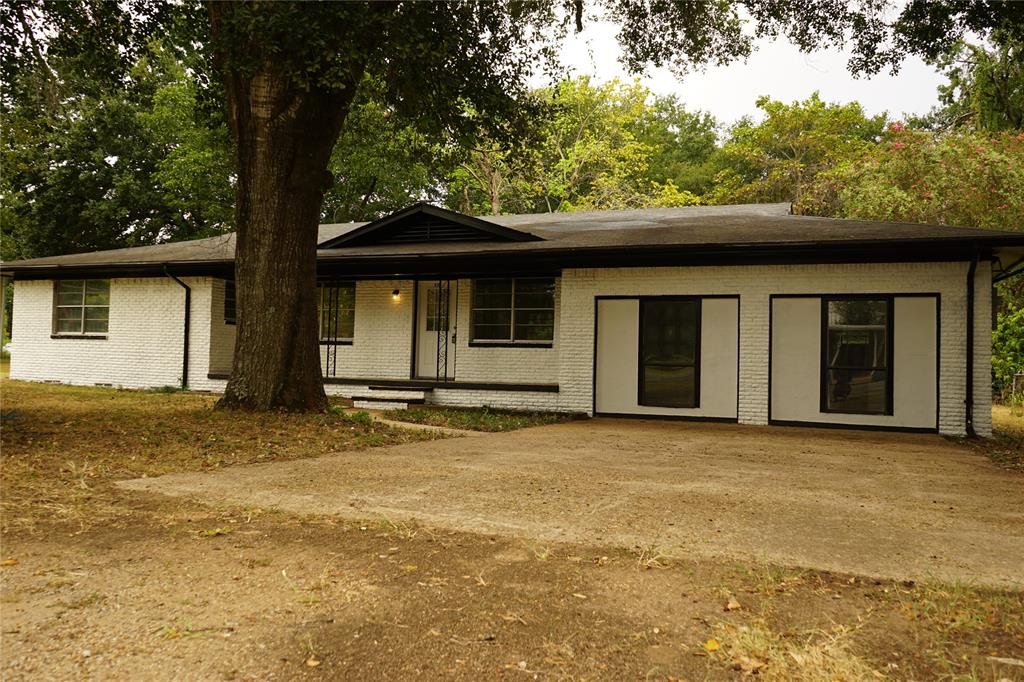 a house with trees in the background