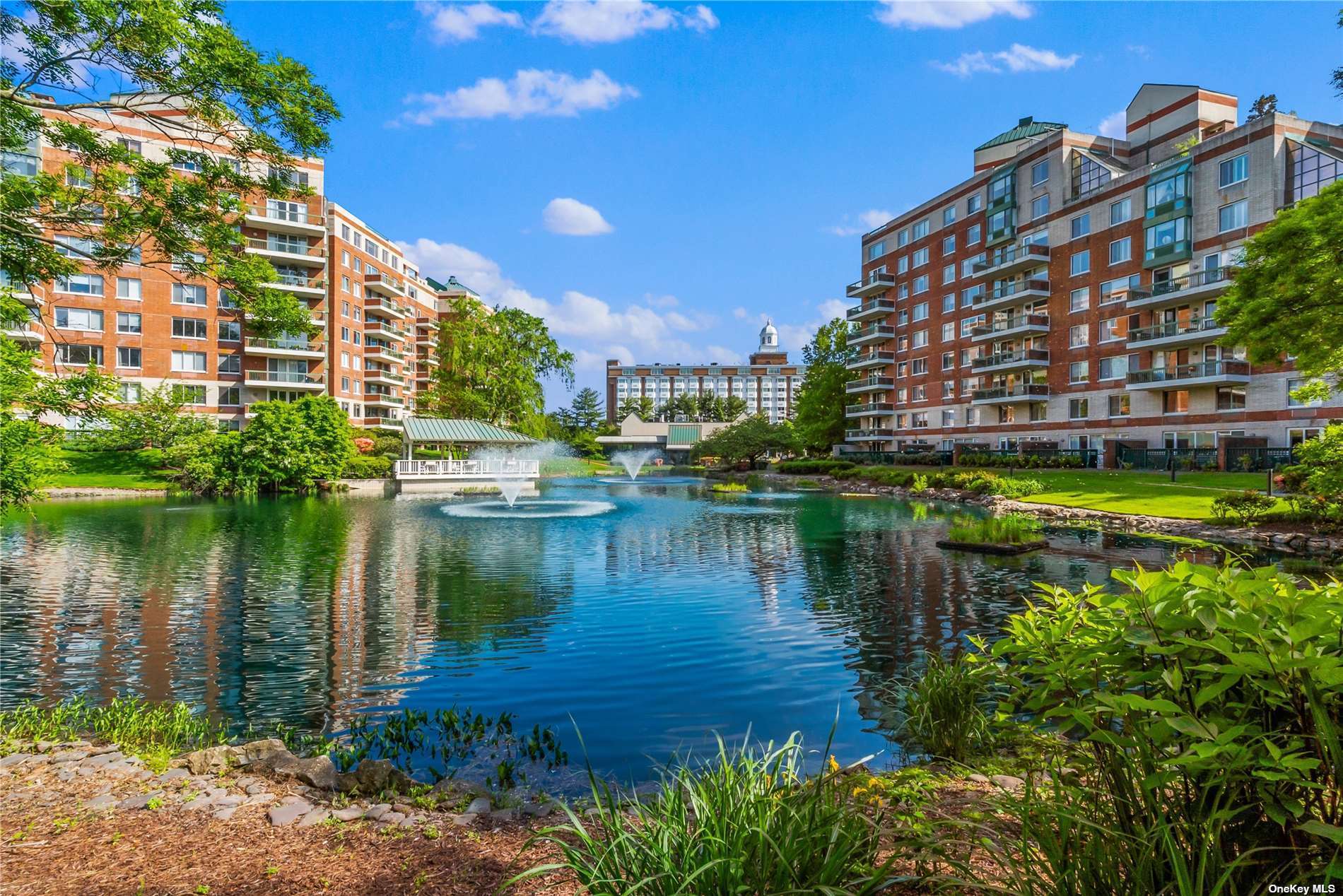 a view of a lake with building and outdoor space