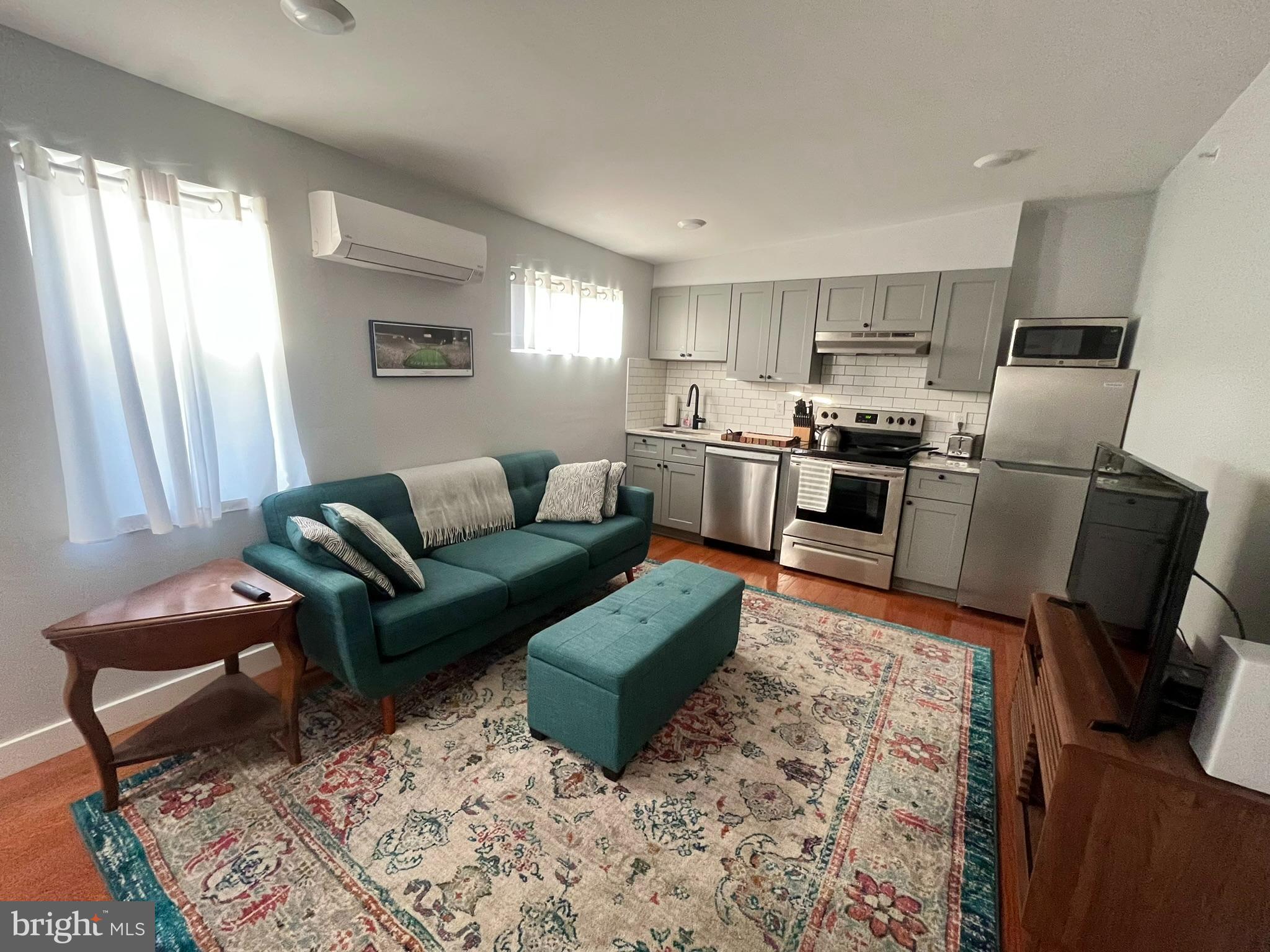 a living room with furniture windows and a fireplace