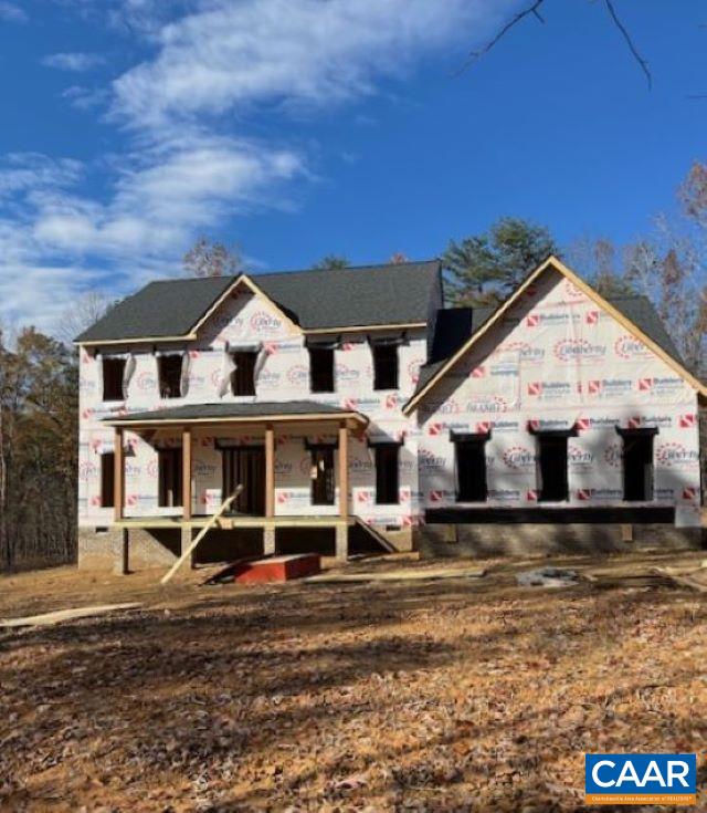 front view of a house with a big yard