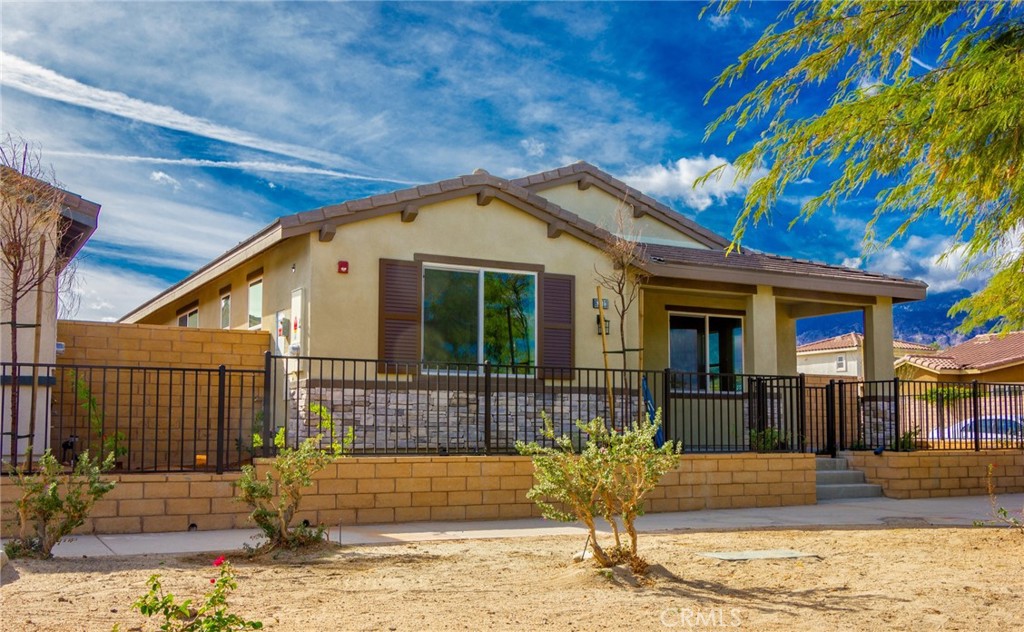 a front view of a house with a outdoor space