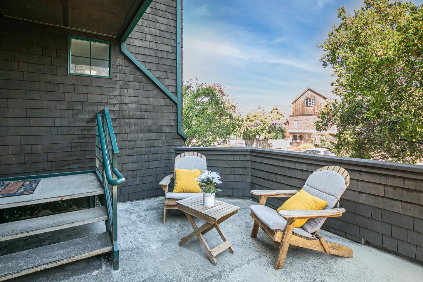 a view of a chairs in backyard