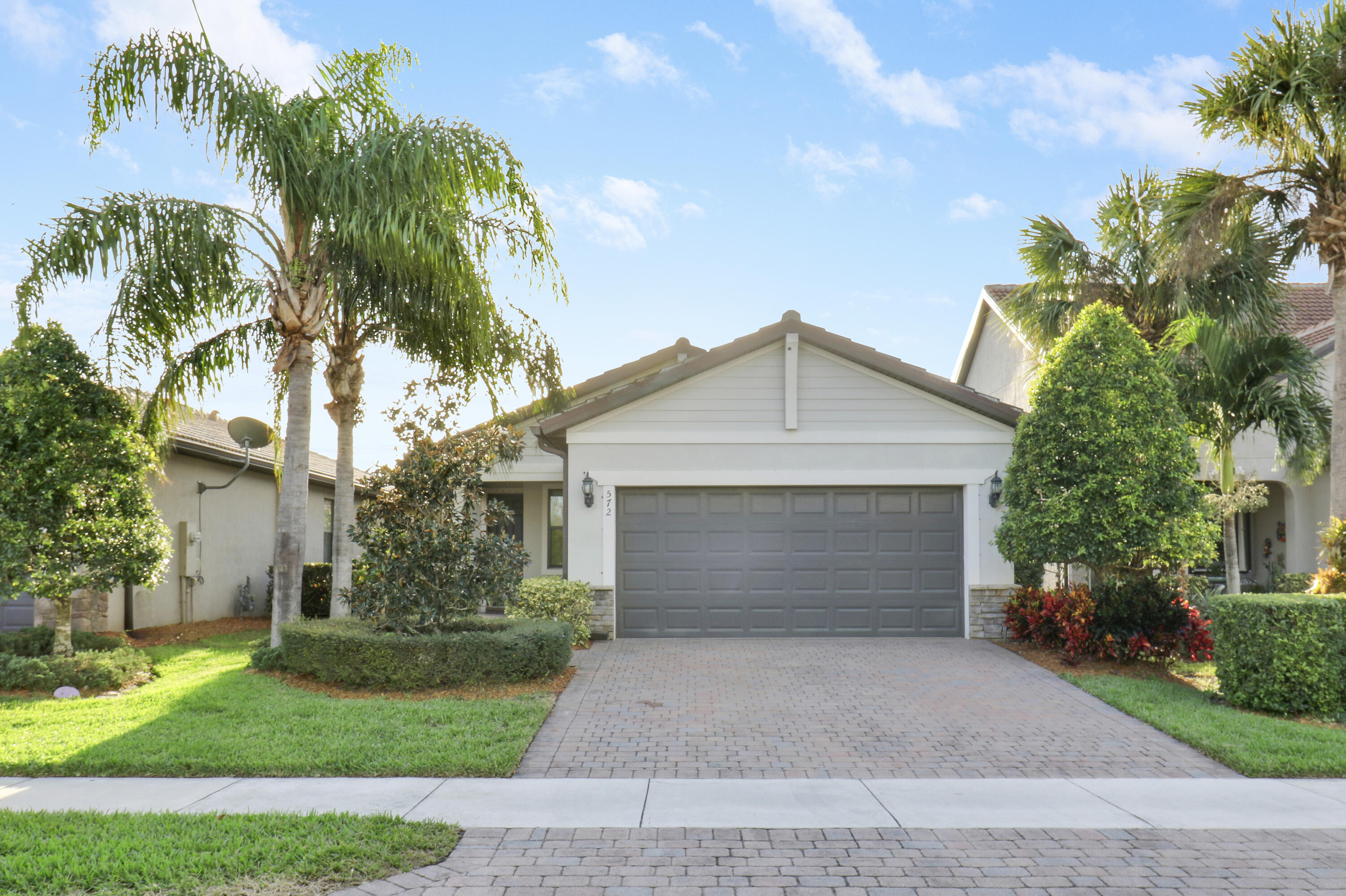 a front view of a house with a garage