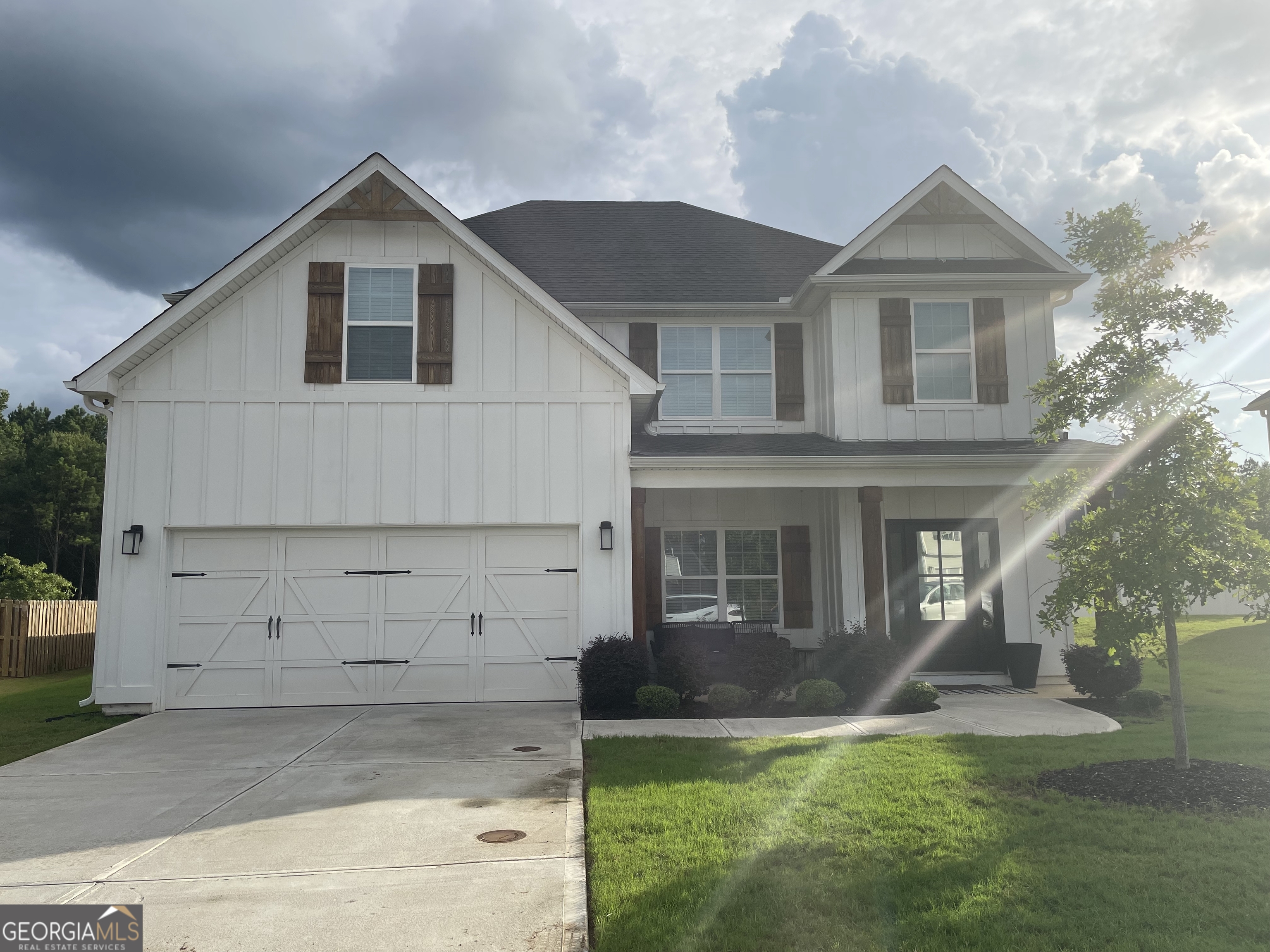 a view of a yard in front view of a house