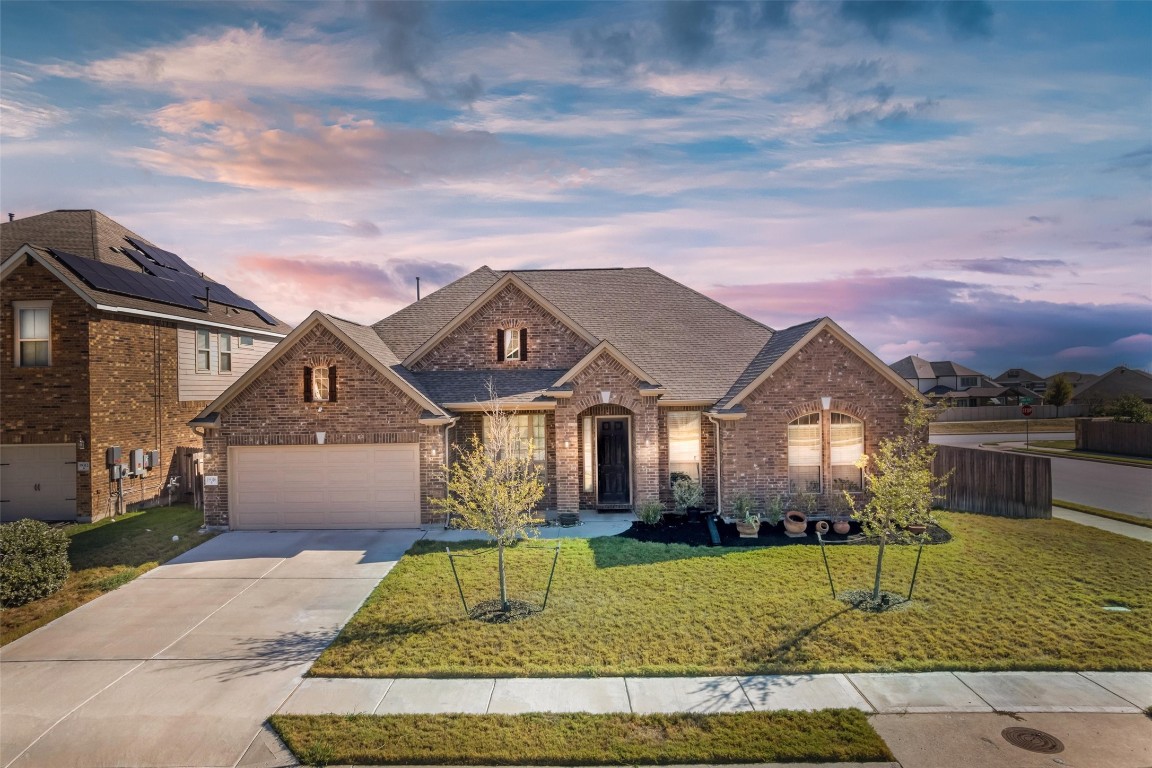 Lovely curb appeal and fantastic landscaping welcome you to this gorgeous corner lot home in the Lakeside at Blackhawk of Pflugerville!