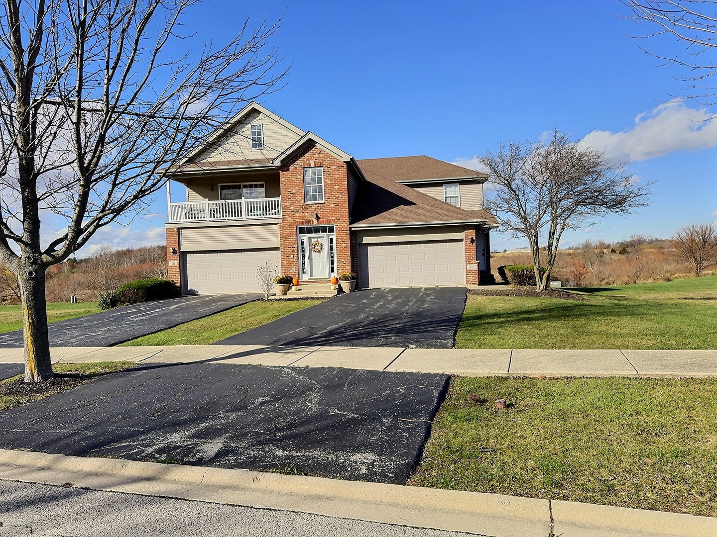 a front view of a house with a yard