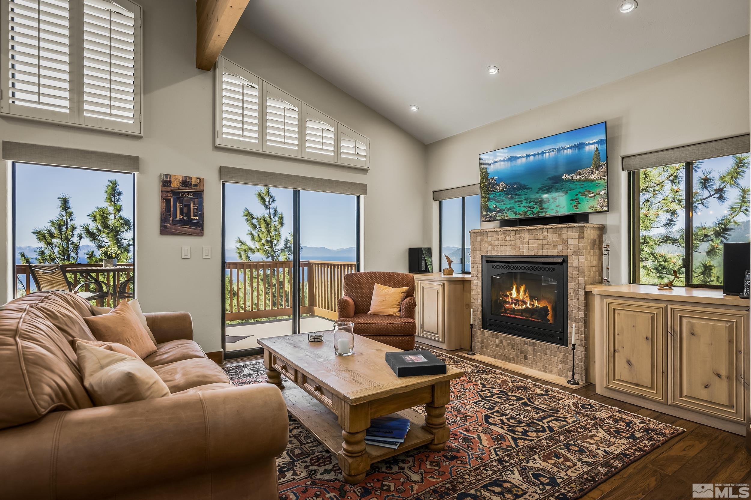 a living room with furniture fireplace and window