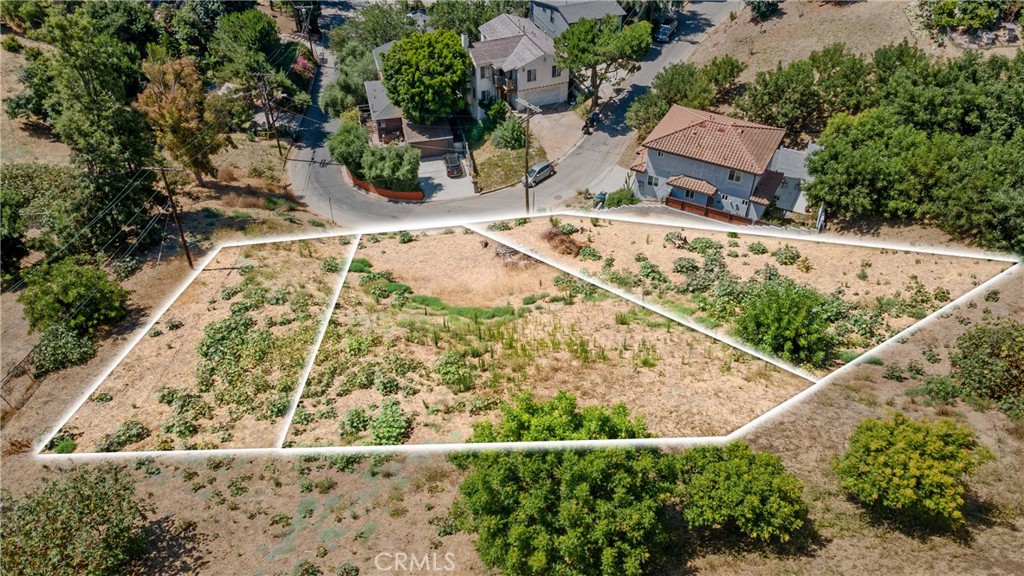 an aerial view of house with yard