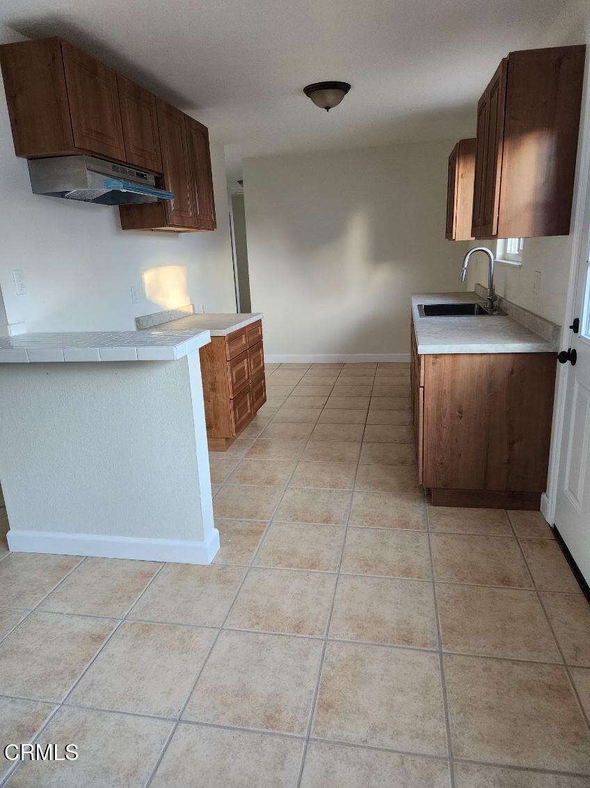 a kitchen with a cabinets and window