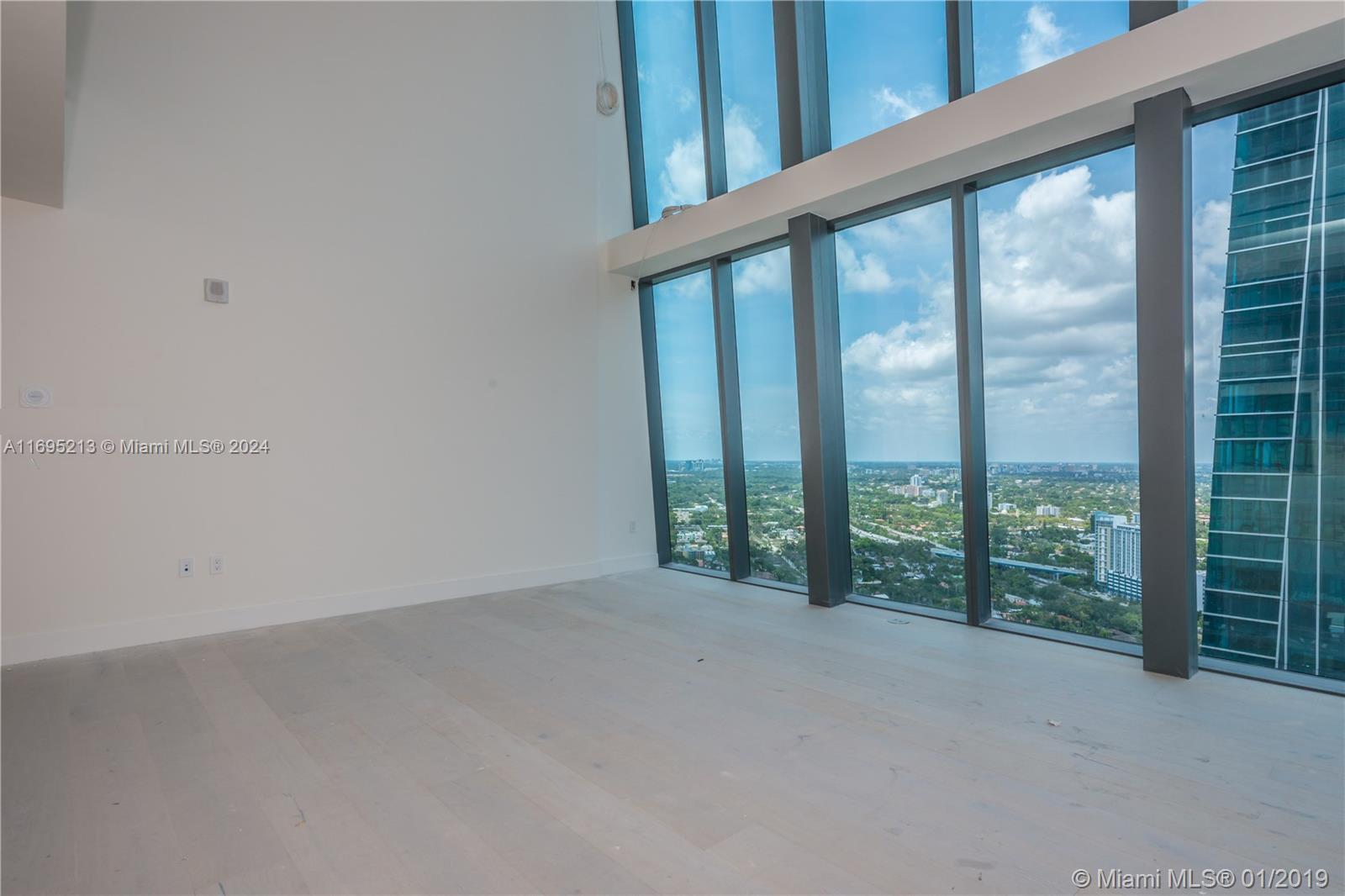 a view of an empty room with windows