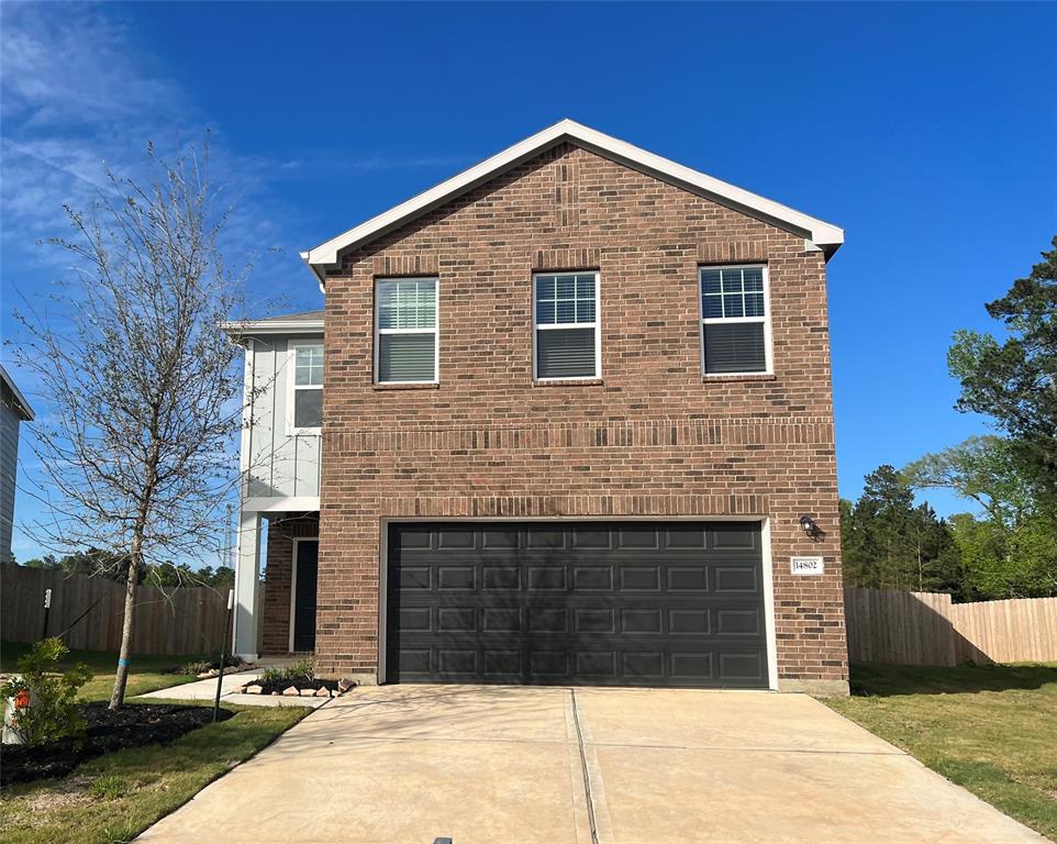 a front view of a house with garage